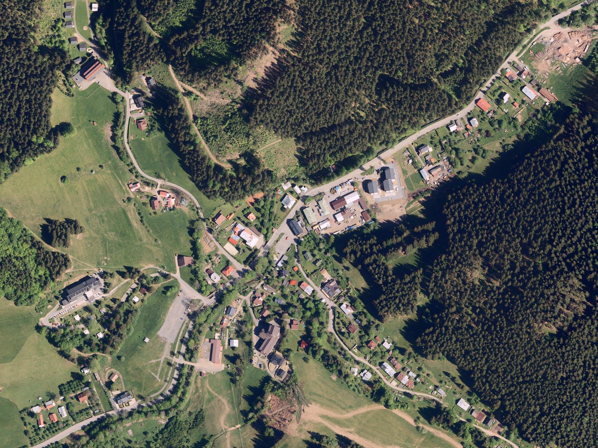 Aerial view of Chalupa Pohoda and the surrounding meadows and forests in Velké Karlovice
