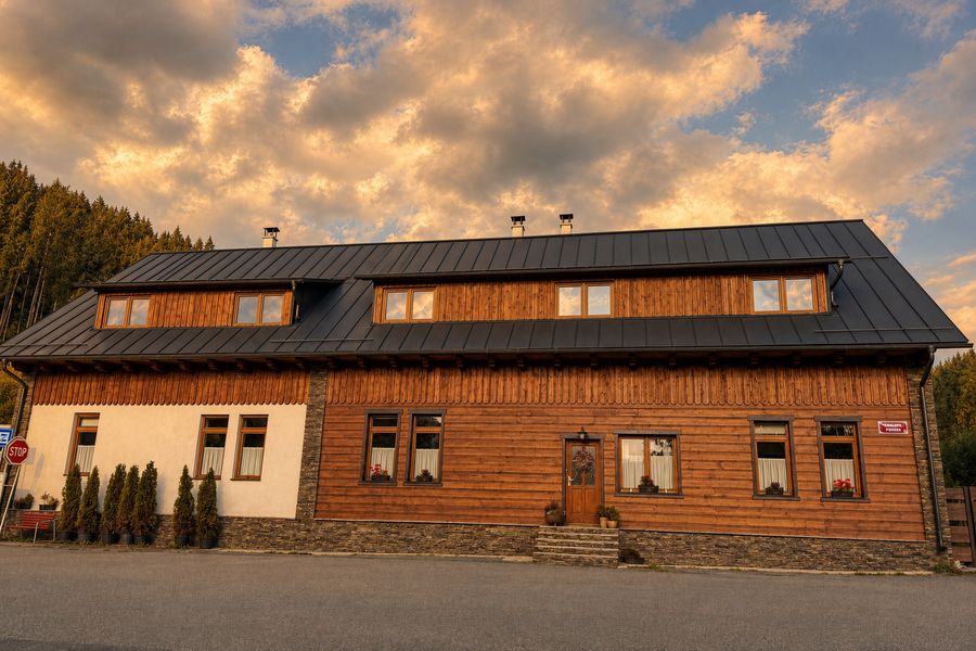 Front of the cottage in golden evening light