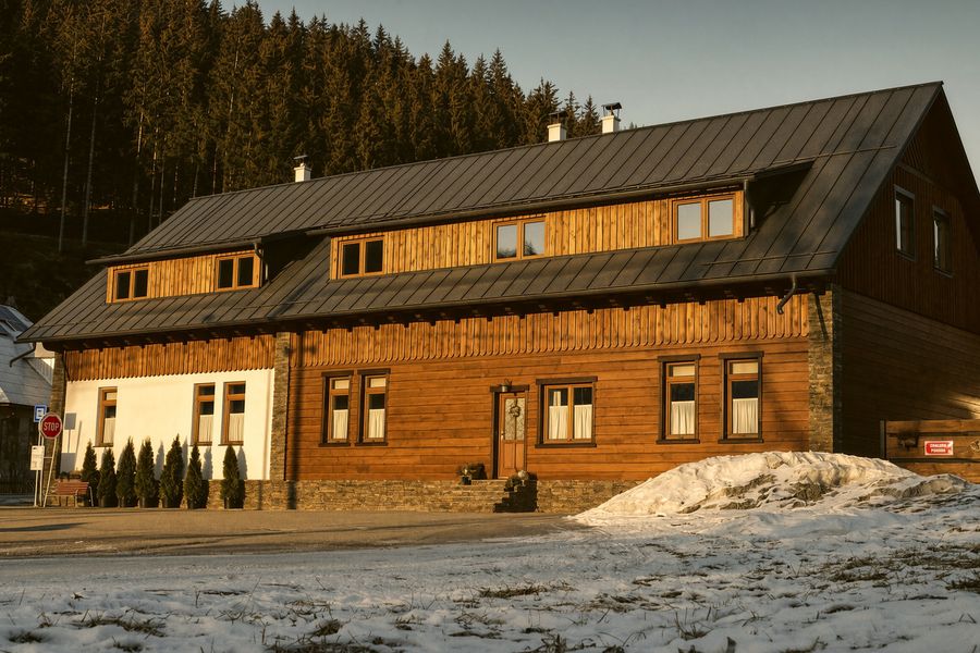 Chalupa Pohoda after its 2025 renovation, front view in winter