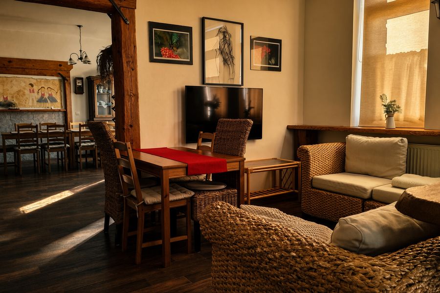 Living room with a sofa and a dining area